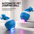 Blue LED automatic jumping dog ball toy on a floor, glowing in pink light mode