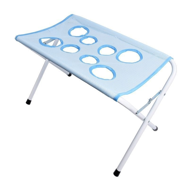 Blue folding mesh bath hammock stand for pets, side angle view